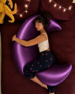 📏 Product Specifications * Product: Premium Solid Fiber Moon Pillow With Purple Colour Cover Pillow * Size: ৫ ফুট (লম্বা ৬০ ইঞ্চি ) × ২৩ ইঞ্চি (চওড়া) * Filling: Premium Solid Fiber * Cover Material: Premium Satin Fabric * Cover: Washable & Removable * Shape: Moon / Crescent Shape * Weight: ৫ কেজি (১০০-২০০ গ্রাম কম বেশি হতে পারে) * Guarantee: ৫ বছরের Solid Fiber Guarantee * Cover Colour : Purple Cover